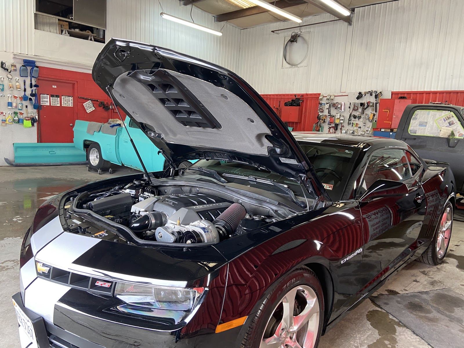 Chevrolet Camaro SS with the hood up, engine bay cleaned and detailed